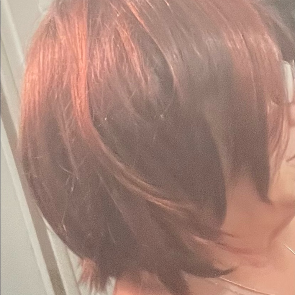 Brown synthetic wig with reddish highlights